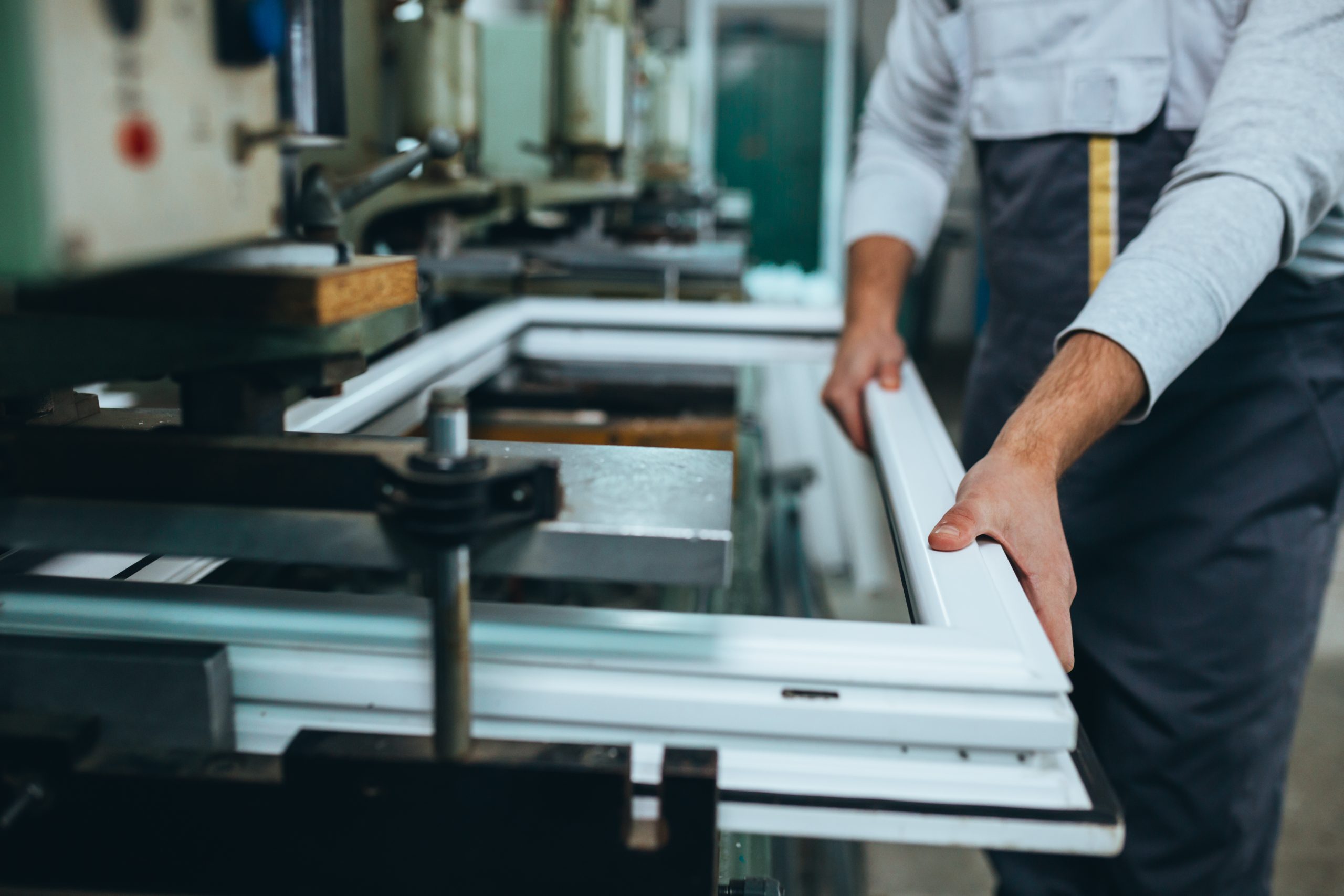 Aluminium and PVC industry worker making PVC or aluminium frames for windows and doors